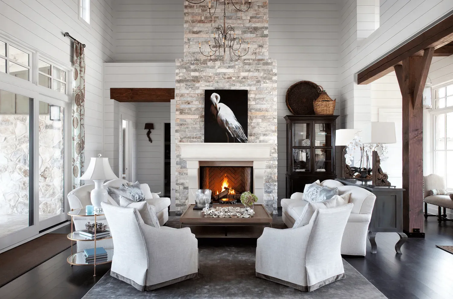 a living room with white furniture and a fireplace home for sale