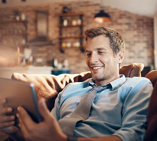 A person in Texarkana TX, sitting on a couch with a Tablet