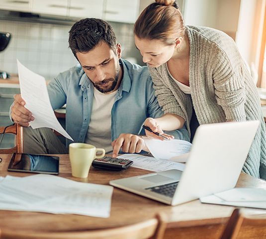 A couple looking at their finances together
