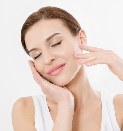 Woman is Getting a Facial Treatment With a Yellow Light on Her Face — Advanced Cosmetic & Beauty Clinic in Bundaberg South, QLD