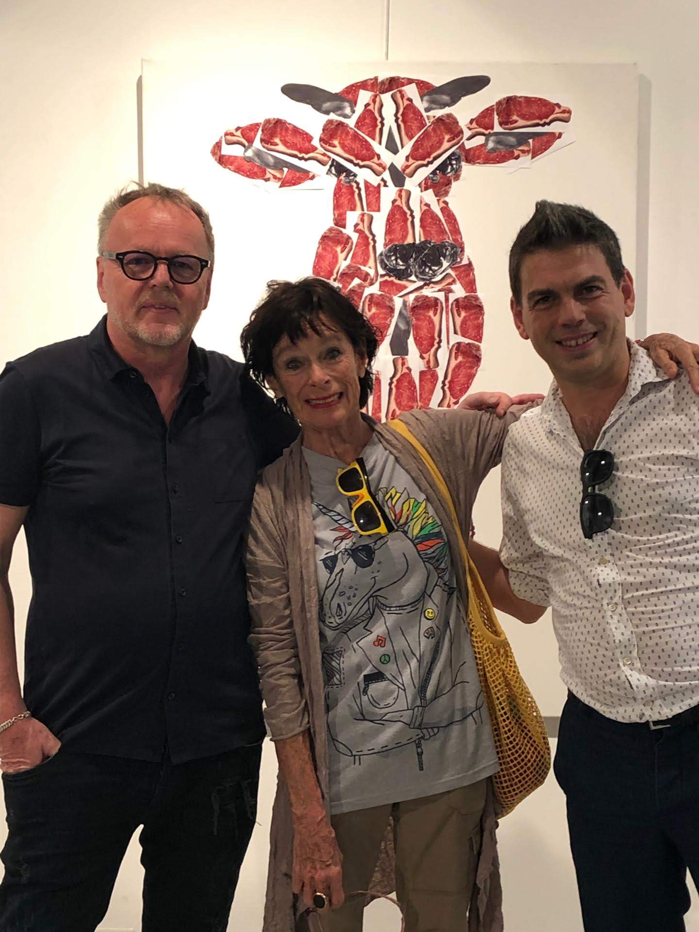 Geraldine Chaplin posing  in front of a painting by Garbade