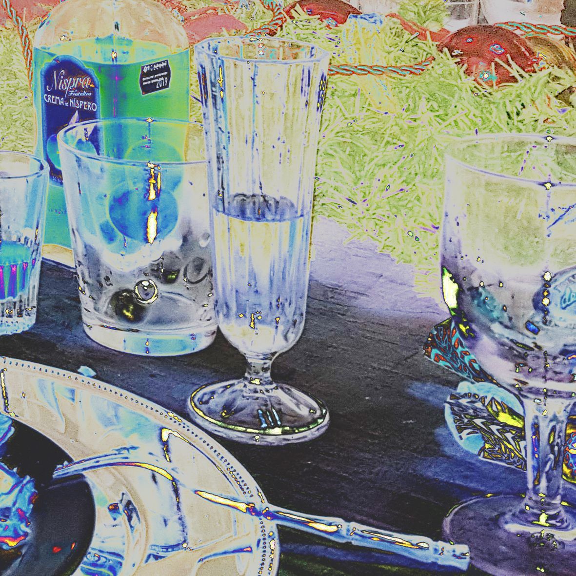 Table setting with glasses, bottle, and plate; vibrant colors, print by garbade