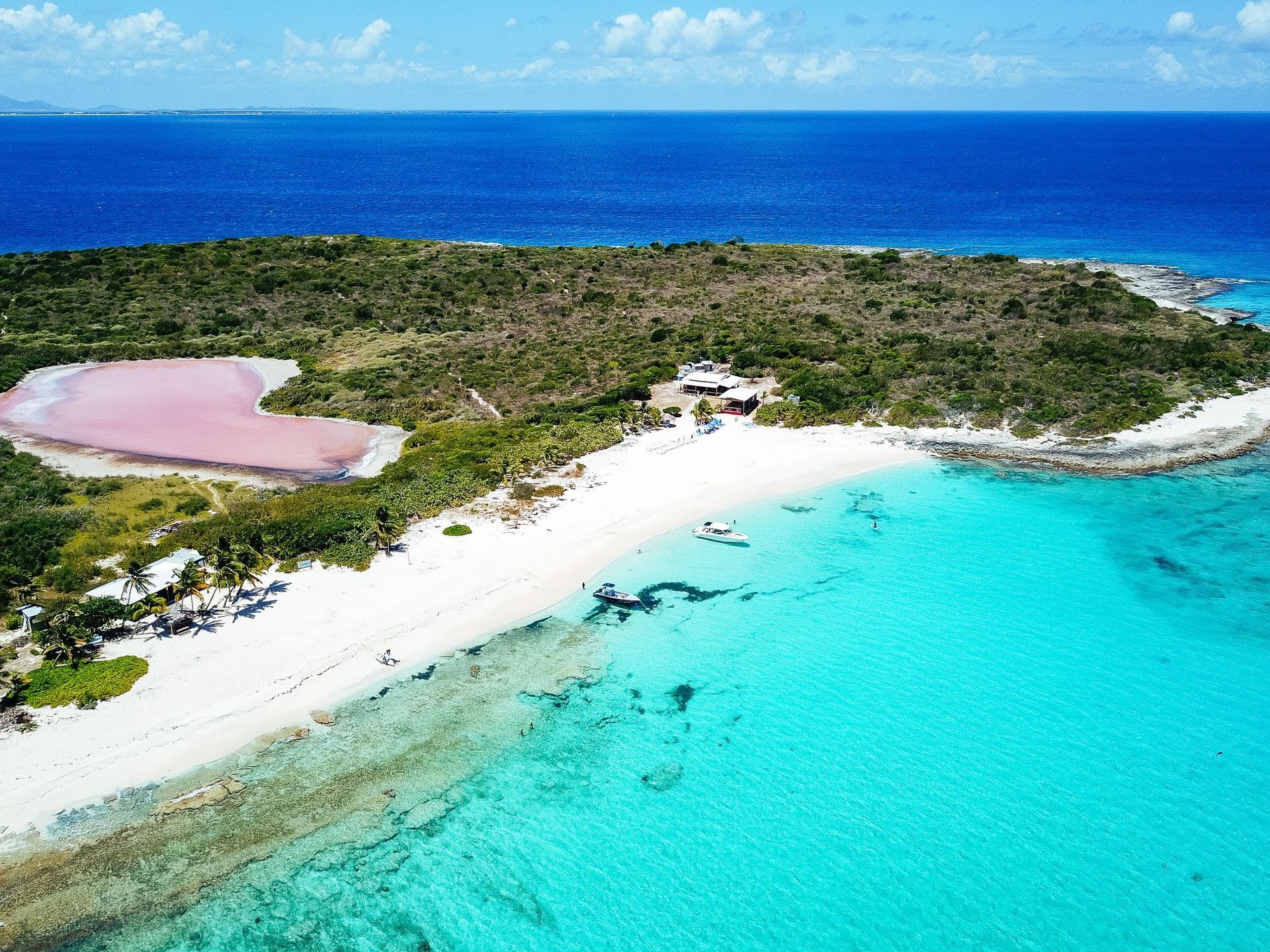 An aerial view of a small island in the middle of the ocean.