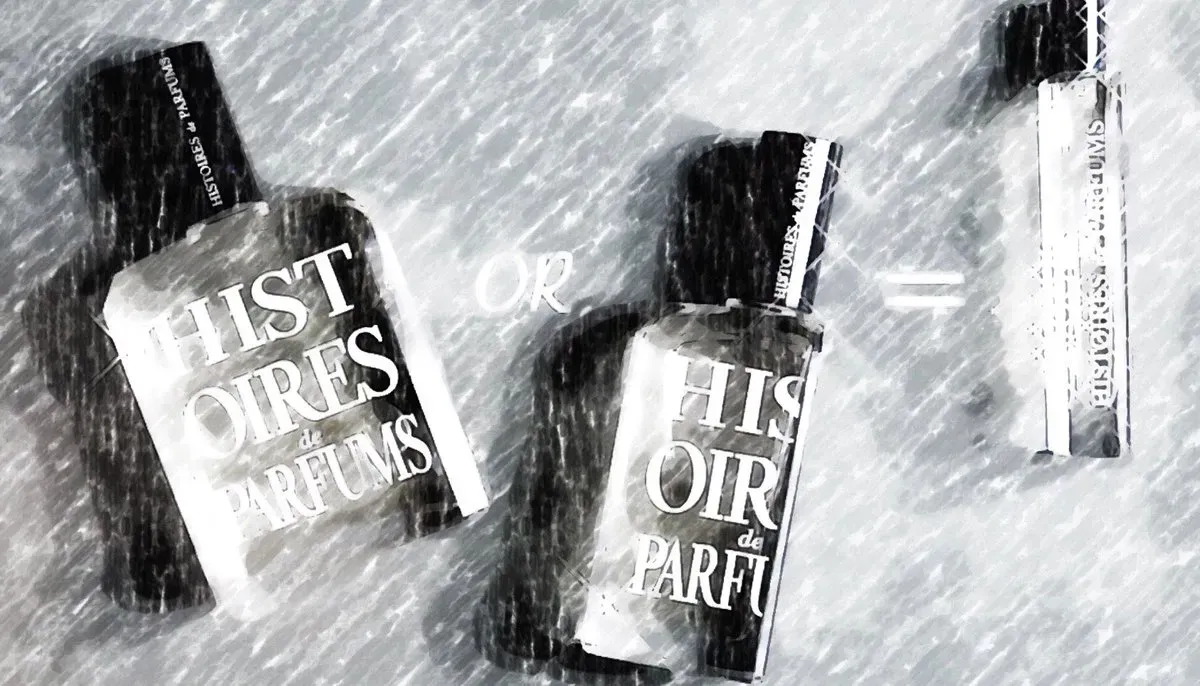 Fotografia in bianco e nero di flaconi di profumo in uno scenario innevato e ventoso, con effetto mosso.