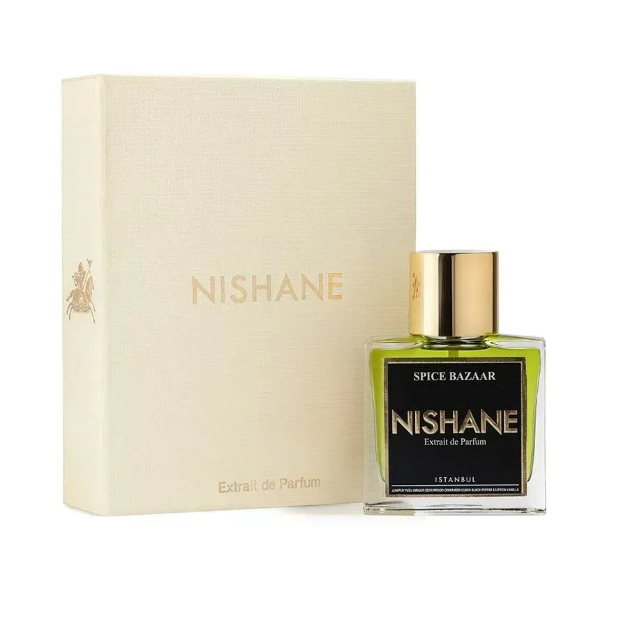 Flacone di profumo Nishane Spice Bazaar accanto a una scatola Nishane color crema.