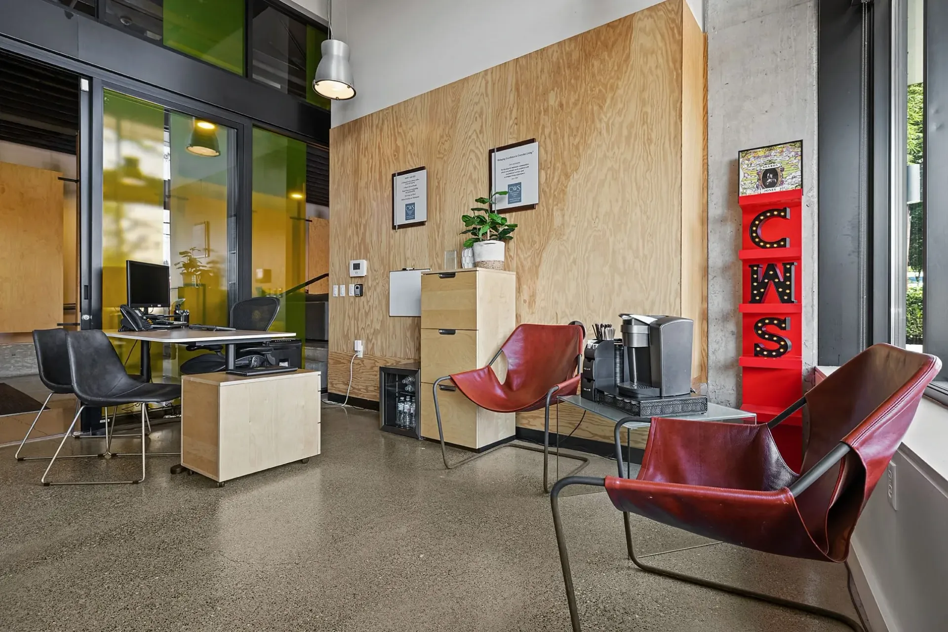 Modern reception area with comfortable seating and a coffee station.