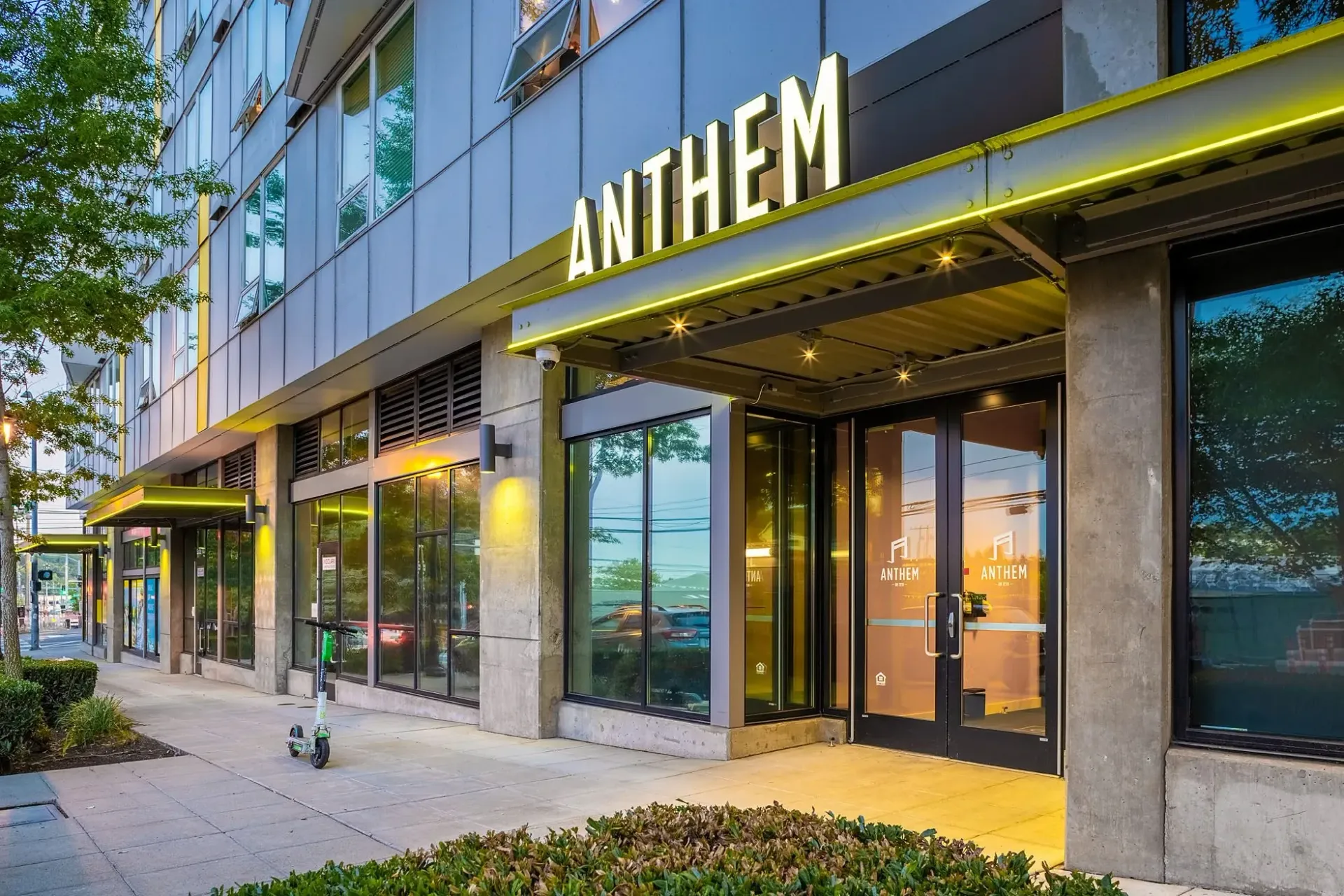 Exterior entrance of the Anthem building with illuminated signage.