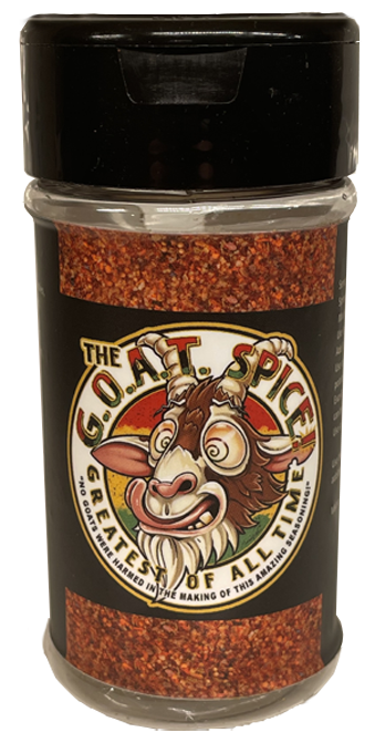A jar of red chili flakes with a black lid and a label reading “Coot’s Spice” with a cartoon face.
