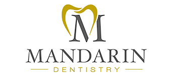 Mandarin Dentistry logo with gold and black stylized &ldquo;M&rdquo; above the name