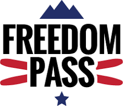 A logo for freedom pass with a mountain and a star.