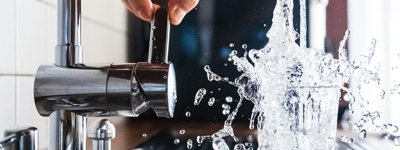 Clean running water from a home faucet representing sewer drain repair services in Akron, OH