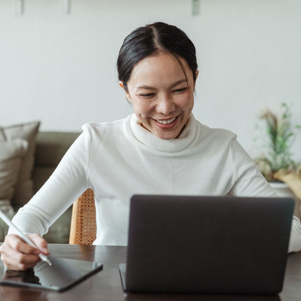 A woman working with her laptop at Overseas Filipino Workers Image of a woman working with her laptop at Overseas Filipino Workers