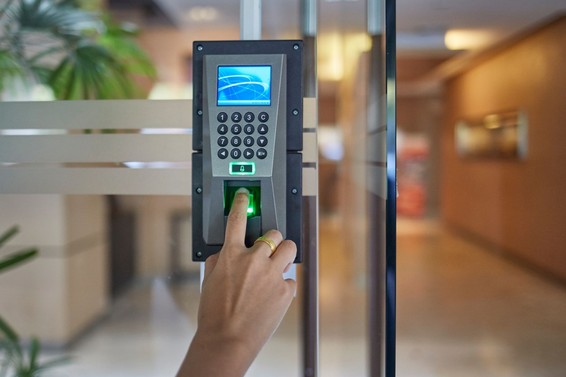 Business access control system with biometric fingerprint scanner and keypad.