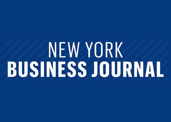 The new york business journal logo is on a blue background.