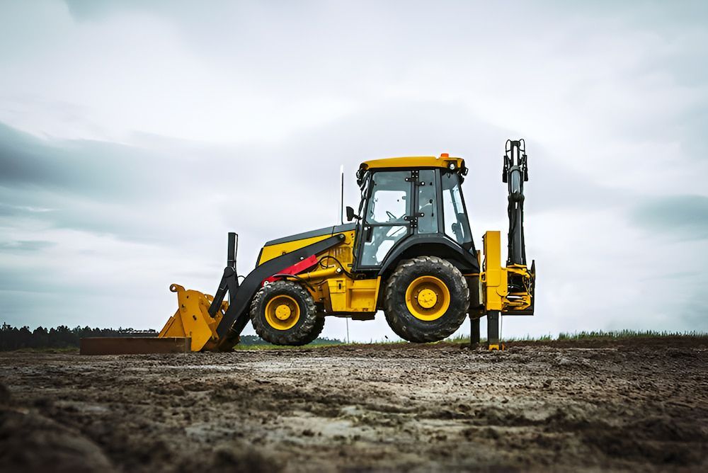 A Yellow Bulldozer Is Parked In A Dirt Field — Jeff Thompson Excavator Hire Pty Ltd In Pink Lily, QLD