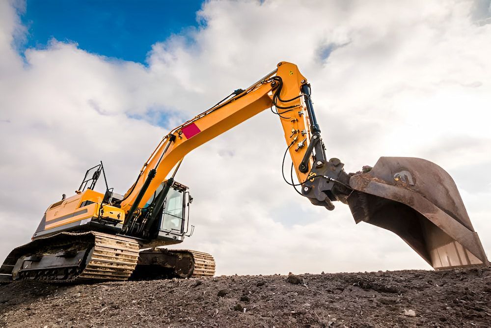 A Yellow Excavator Is Digging A Hole In The Dirt — Jeff Thompson Excavator Hire Pty Ltd In Pink Lily, QLD
