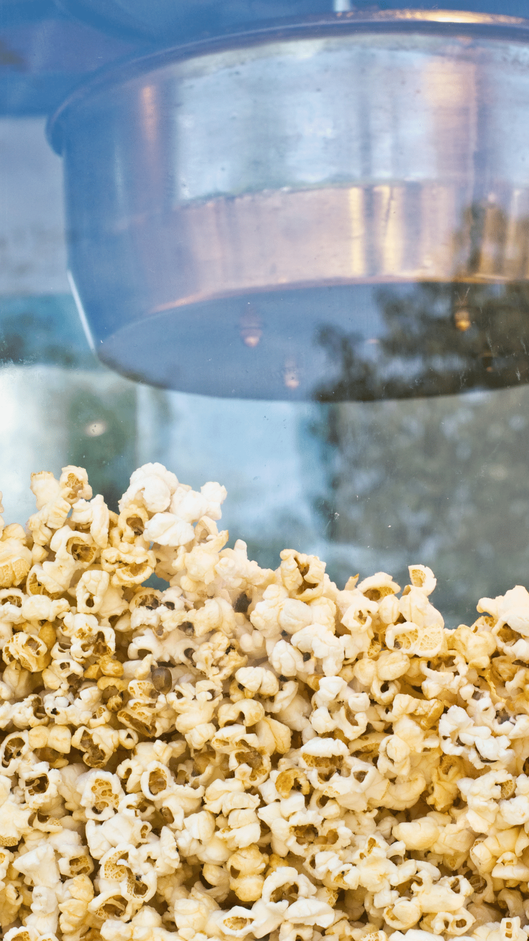 a close up of a popcorn machine filled with popcorn .