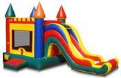 a colorful bouncy castle with a slide attached to it .