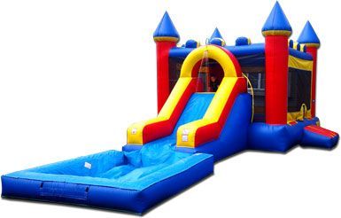 a red , yellow and blue bouncy castle with a water slide attached to it .