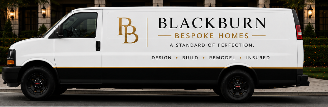Blackburn Restoration & Construction service van, white with black and gold lettering, side view on street