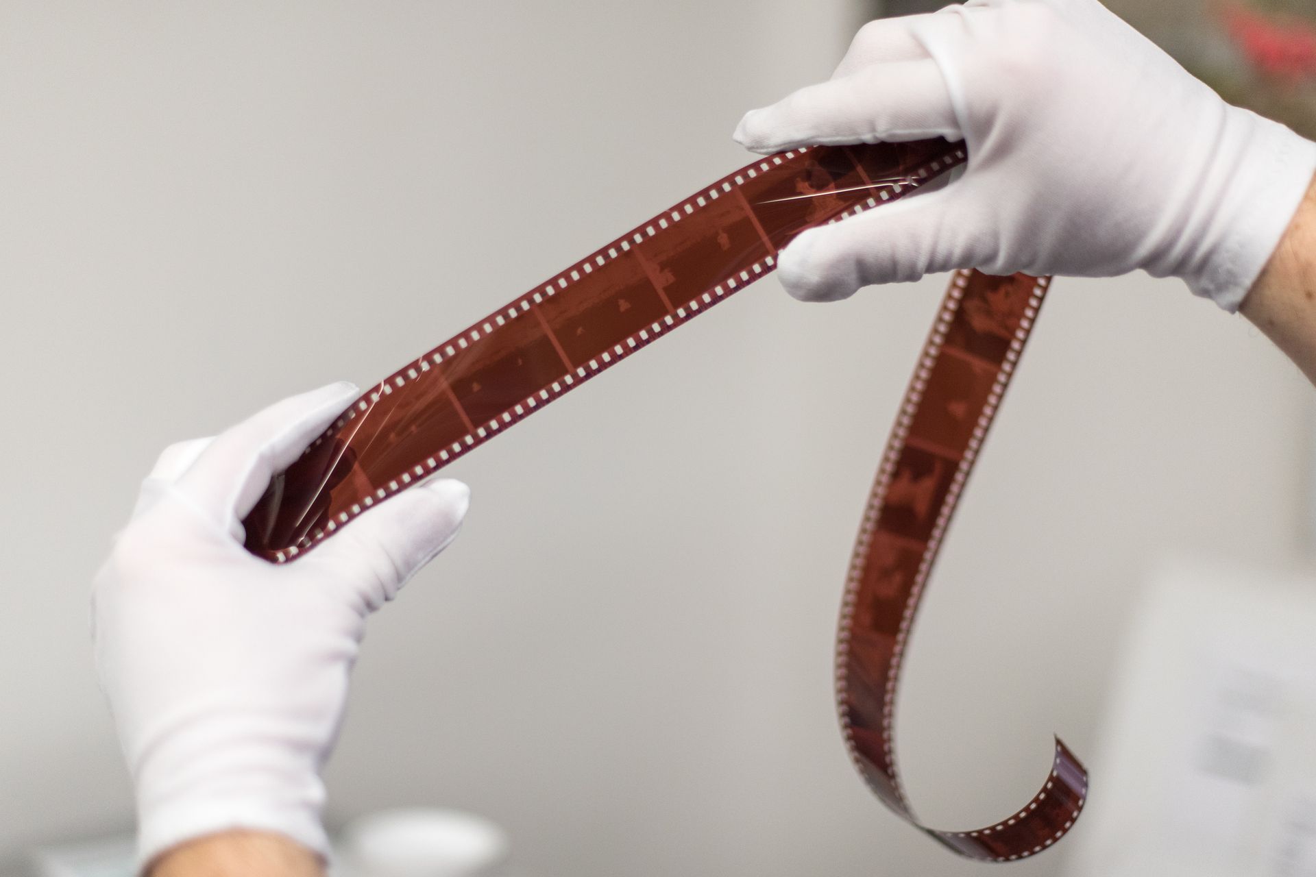 hands holding film strip
