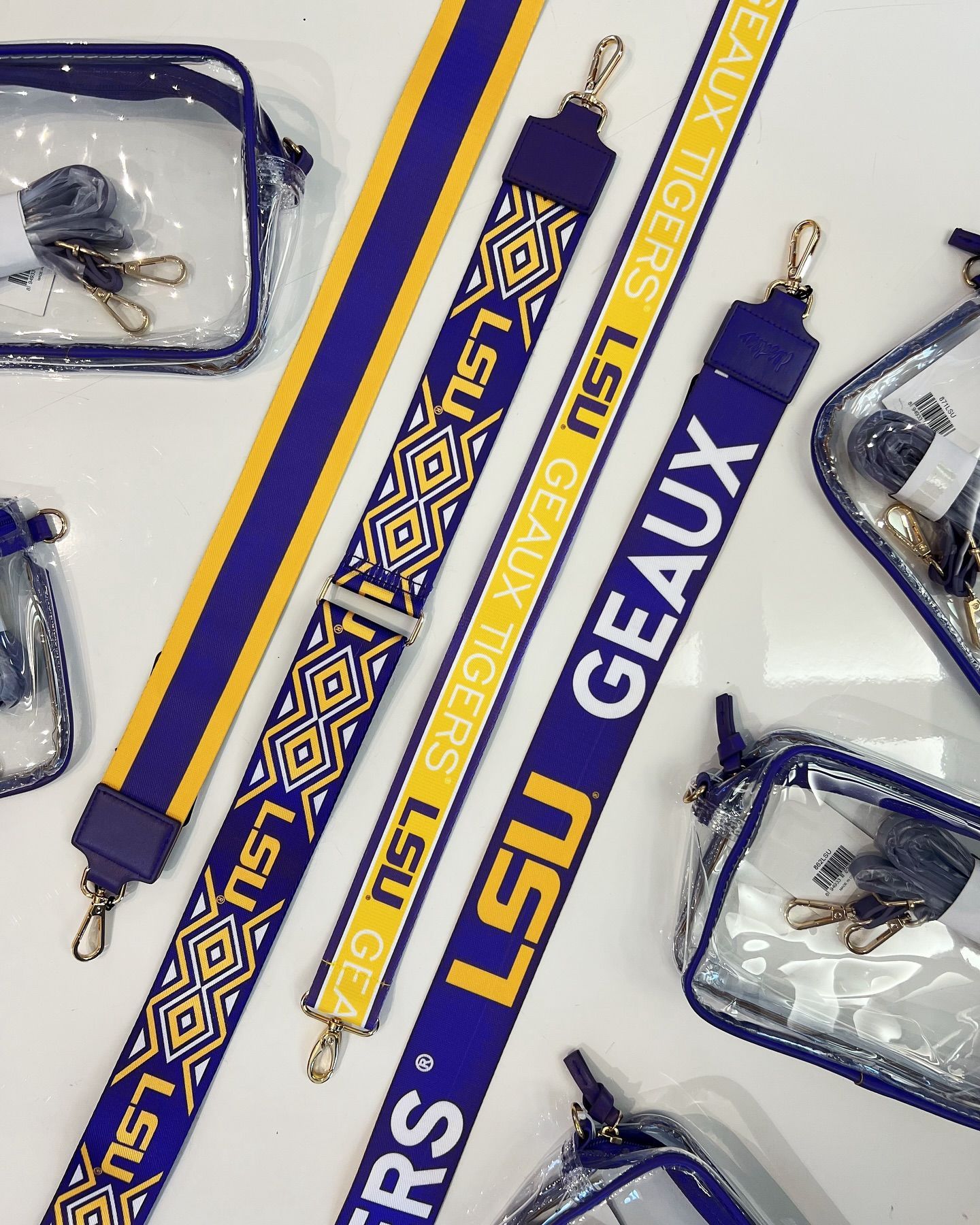 A set of lsu geaux straps and clear bags