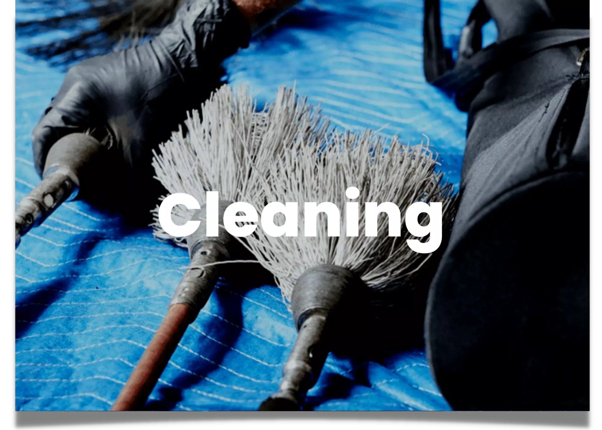Chimney sweep contractor laying out tools to clean out a client's chimney.