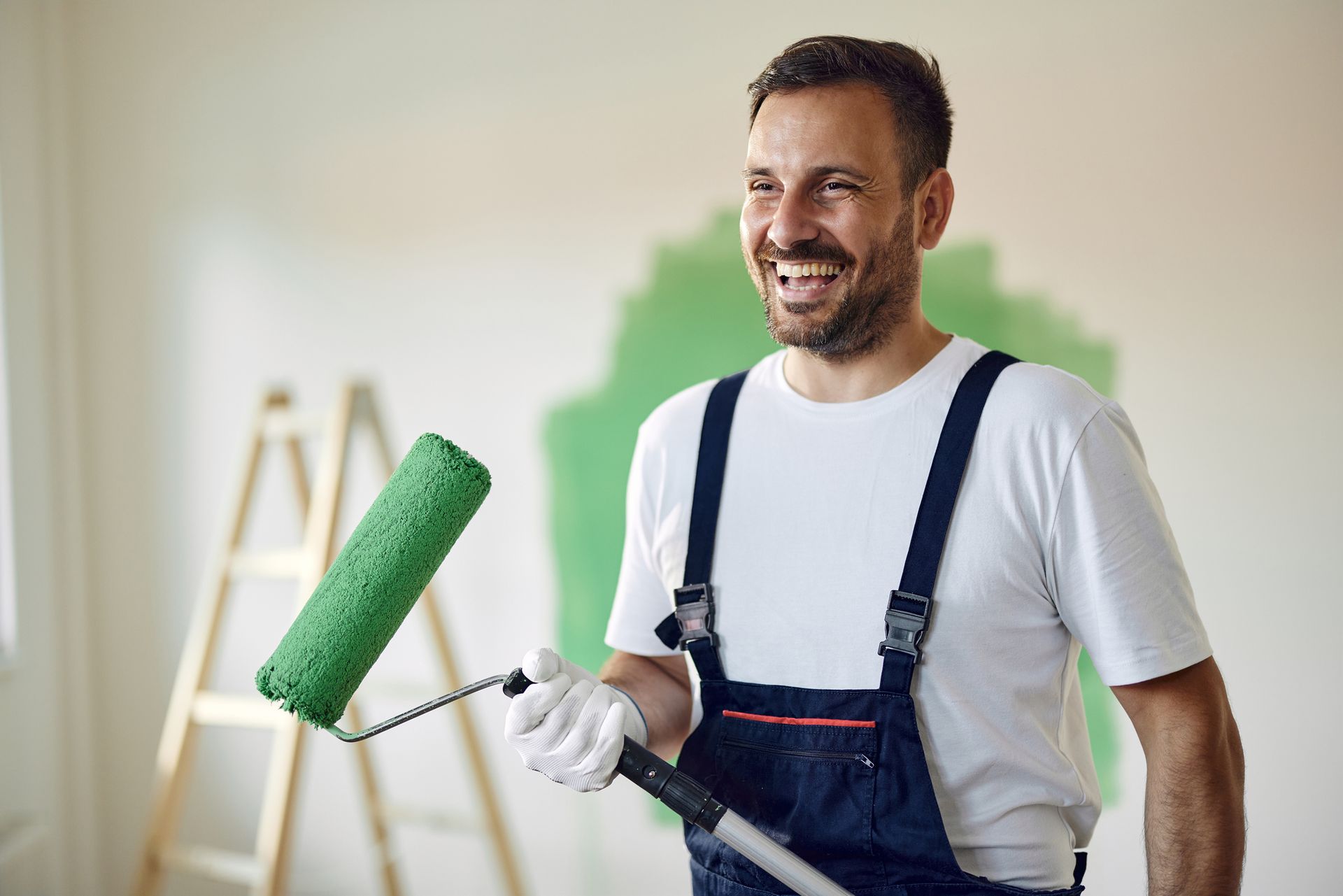 Image of a Tradie with Paint Roller