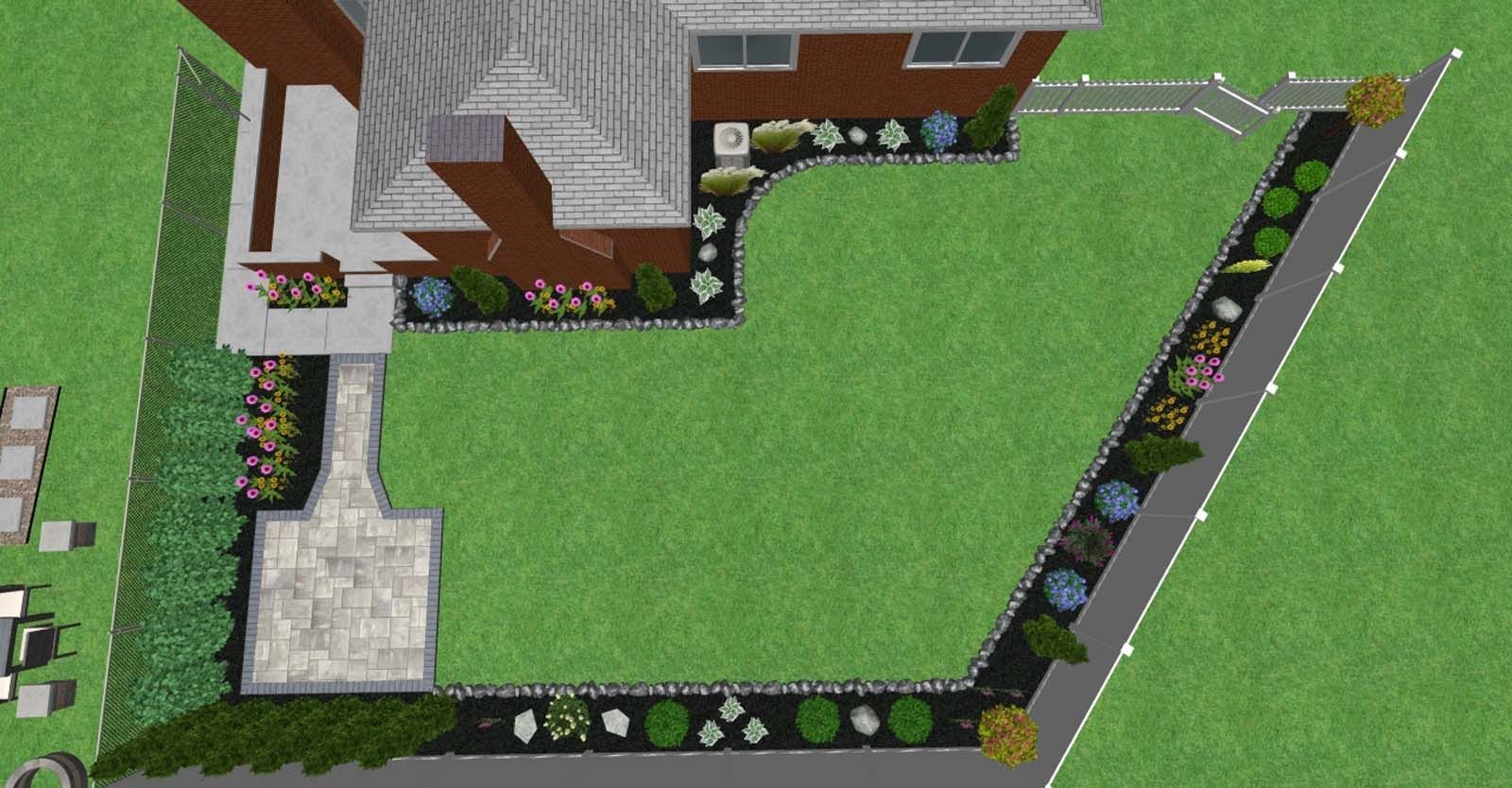 Aerial view of a house with a large green lawn, paved driveway, and landscaped border fencing