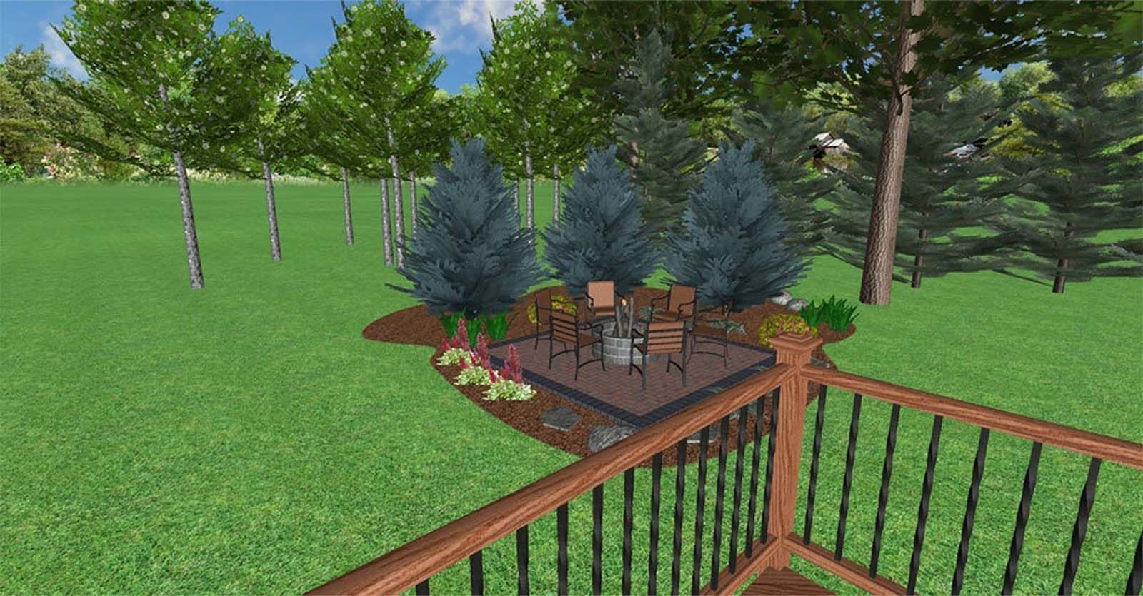 Wooden patio with chairs and table beside blue evergreens in a green yard, viewed from a deck railing