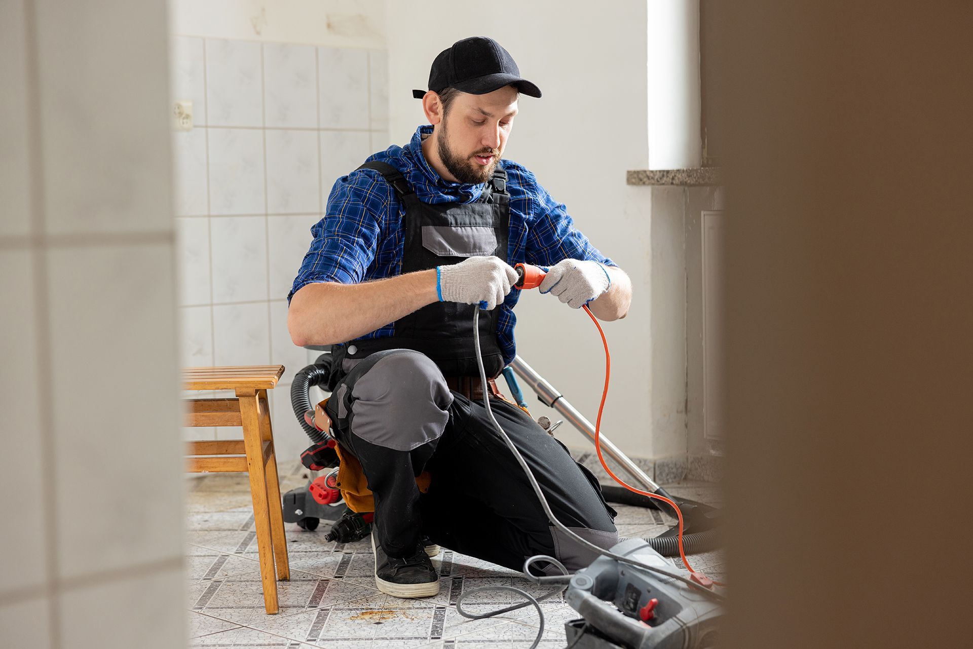 Man Holding the Extension Cord