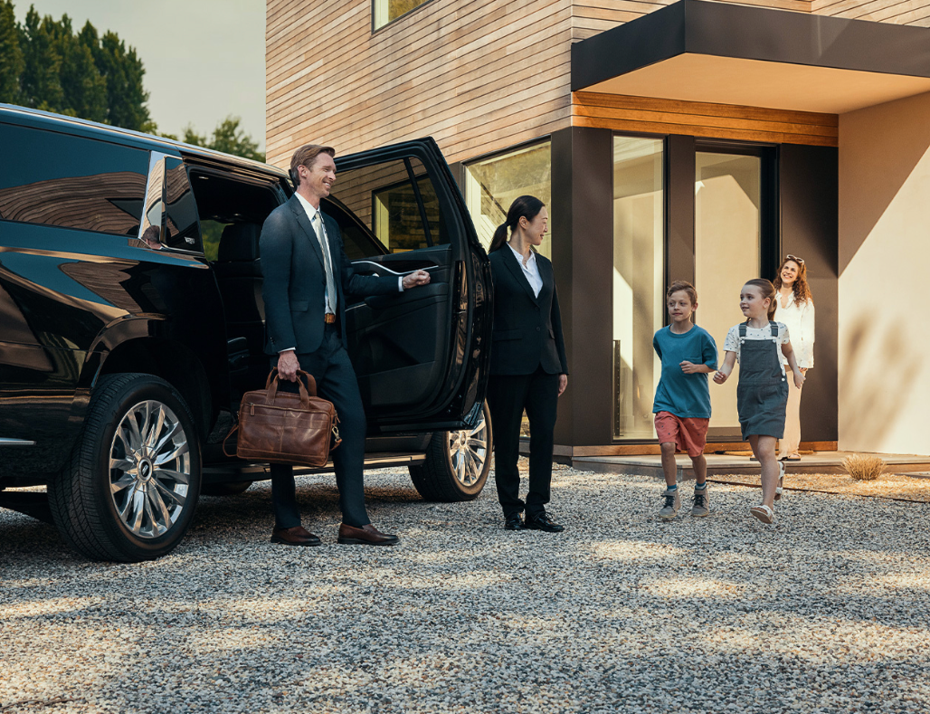 Business man coming home to his family after a business trip