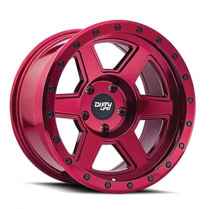 A close up of a red wheel on a white background.