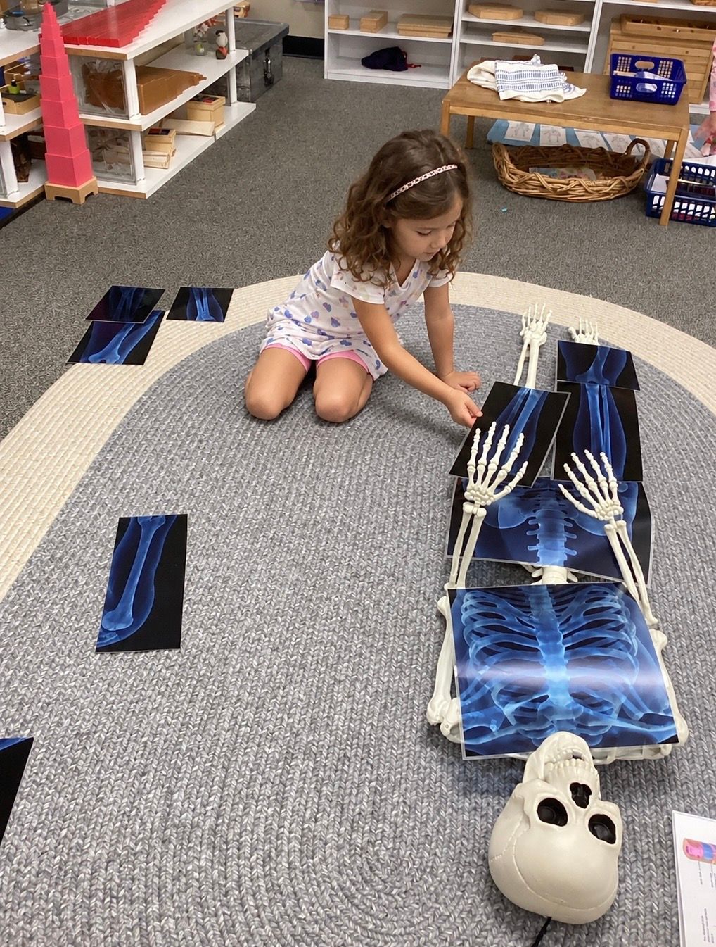 Child working with Montessori math materials