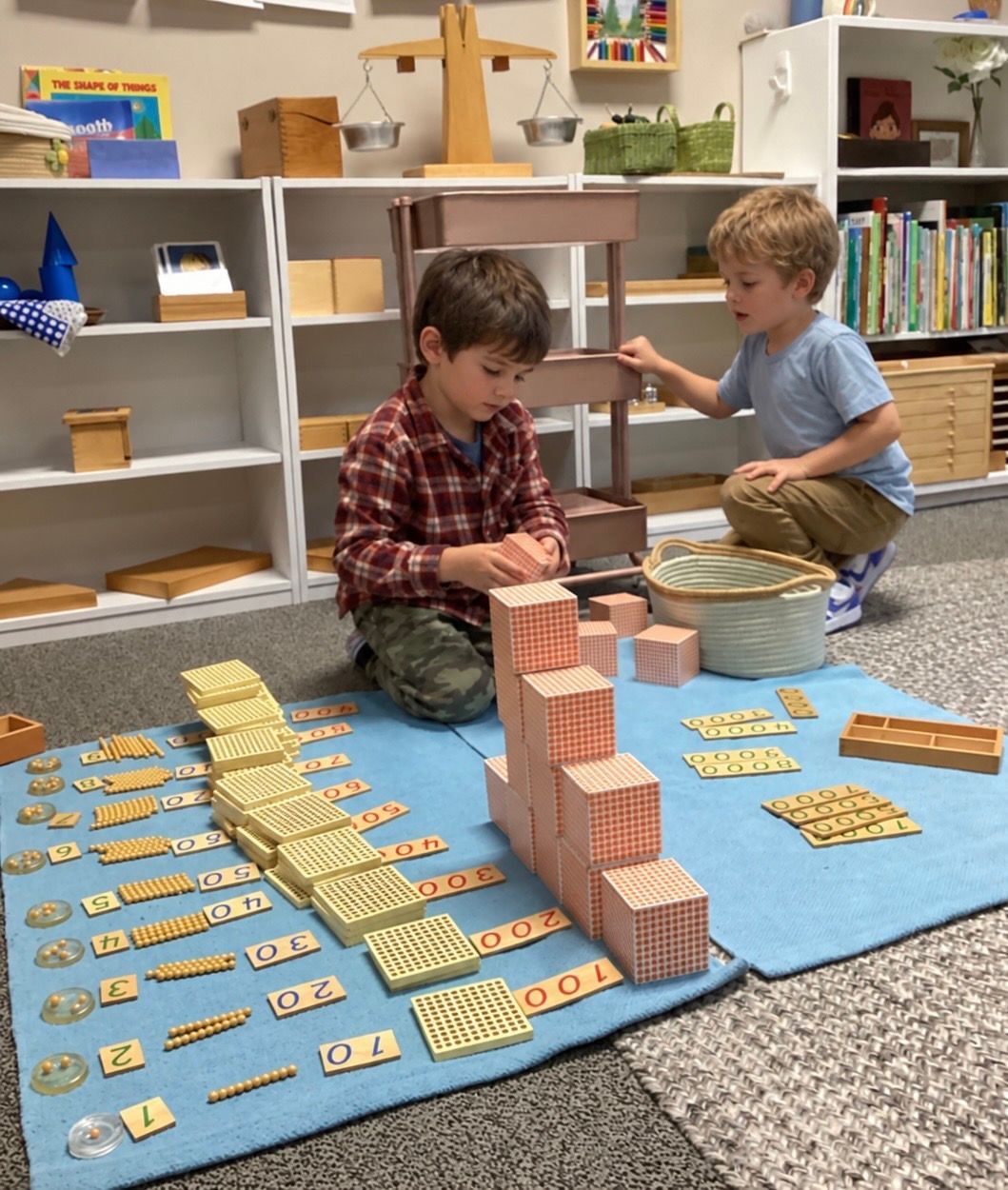 Montessori child working with the golden beads materials