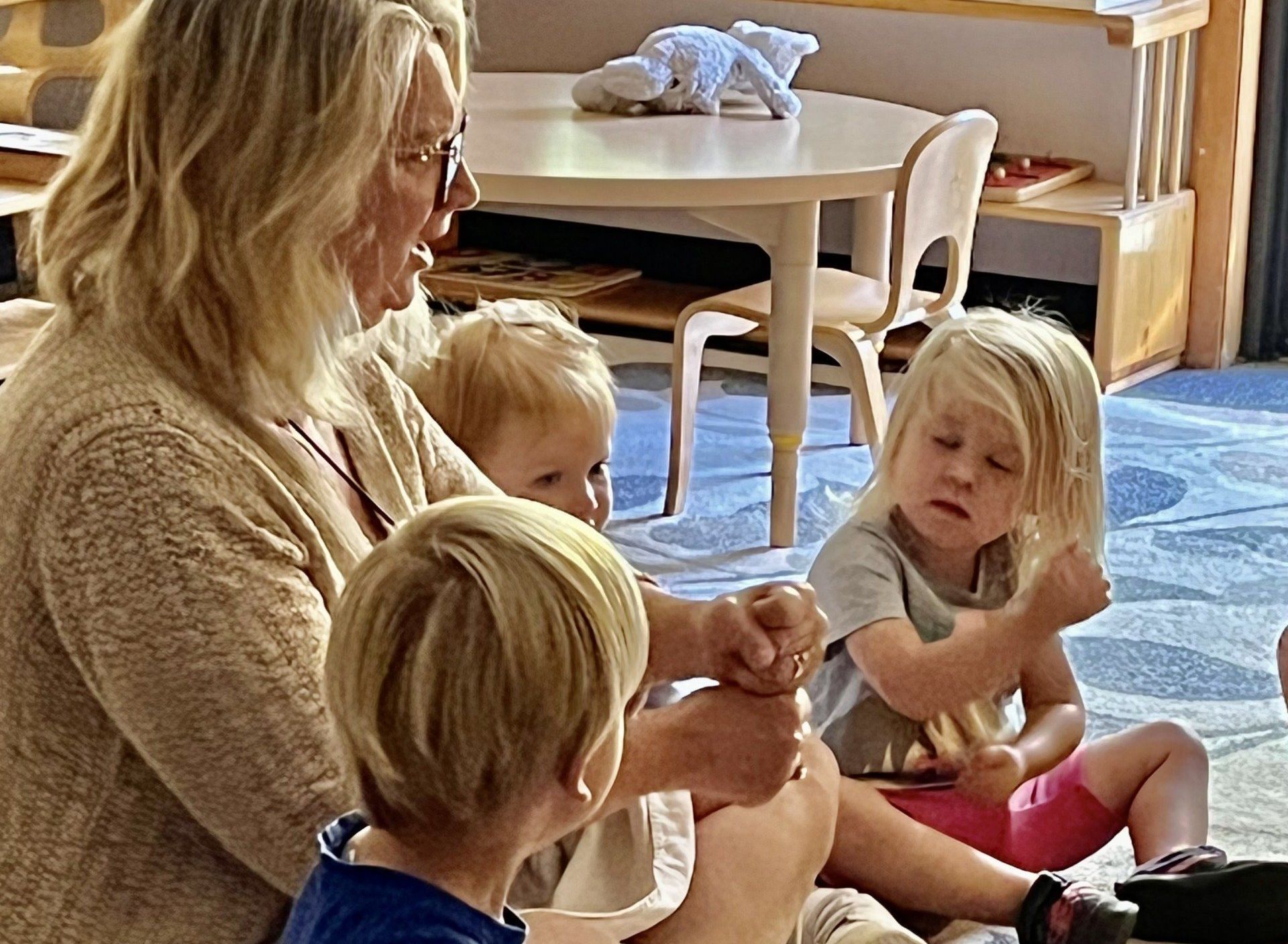 Montessori guide and children in the classroom