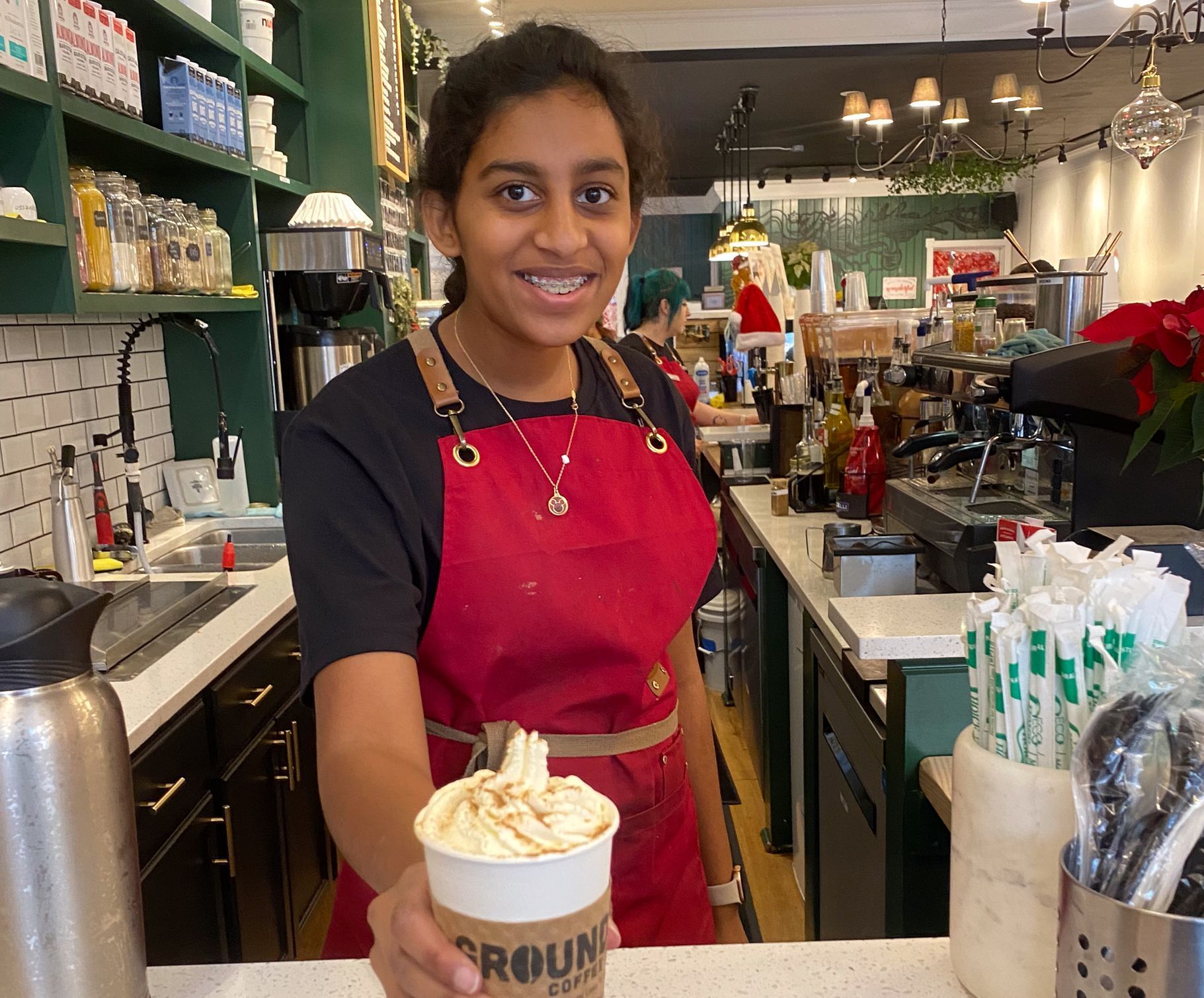 Montessori middle school student working in a coffee shop
