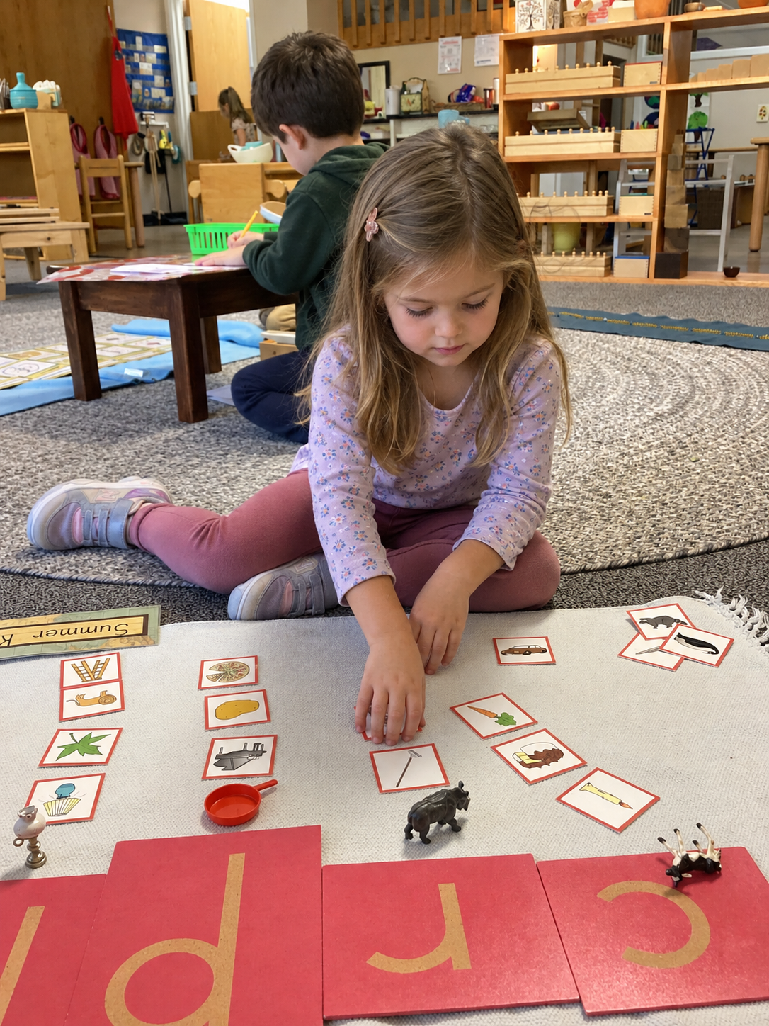 Child working with Montessori math materials