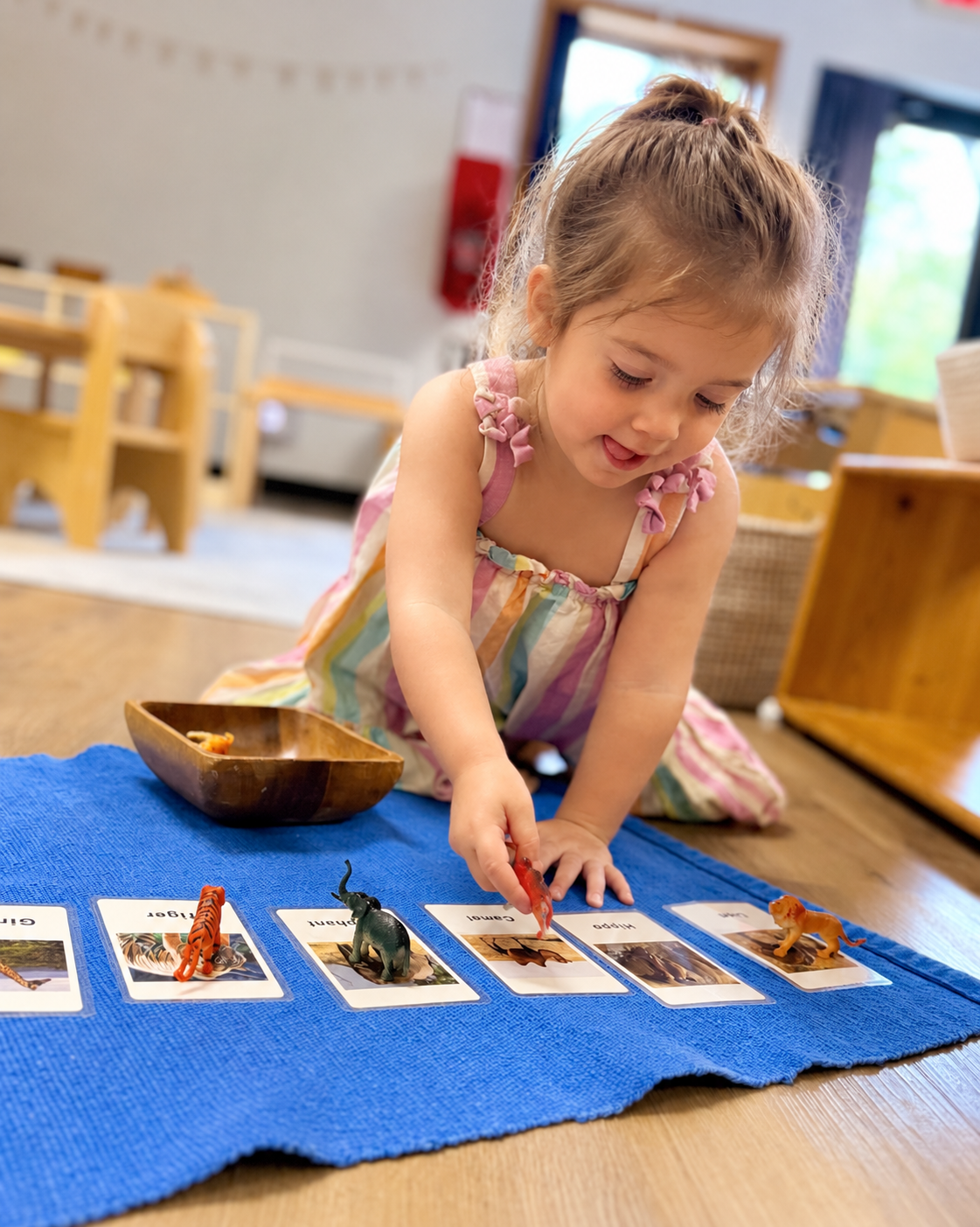 Montessori toddler working on practical life skills