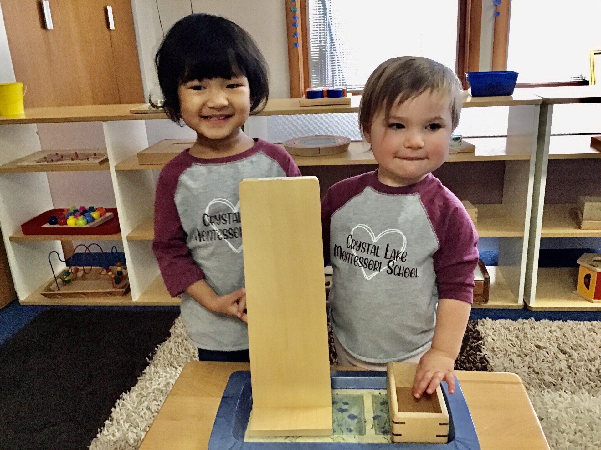 Montessori toddlers working in the classroom