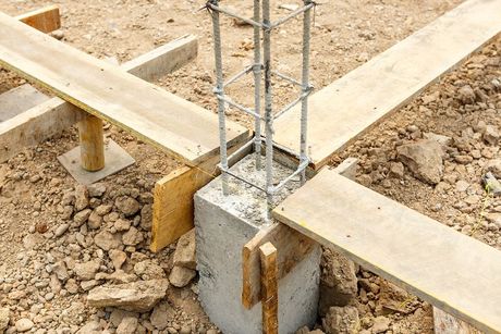 a construction site with a concrete slab and scaffolding