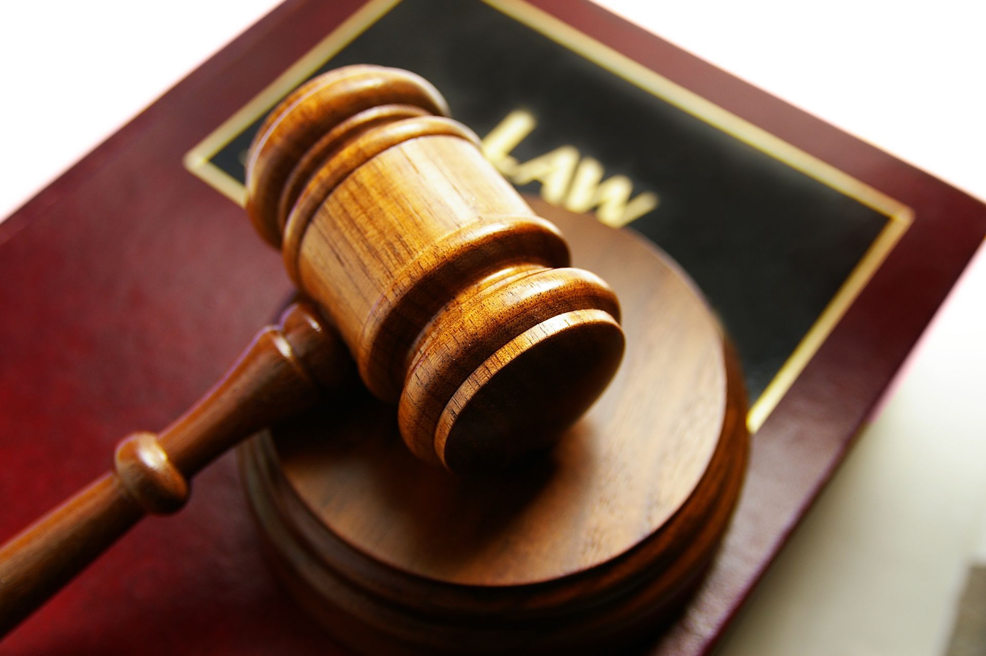 Legal book with gavel, showcasing a family lawyer providing guidance on family law issues.