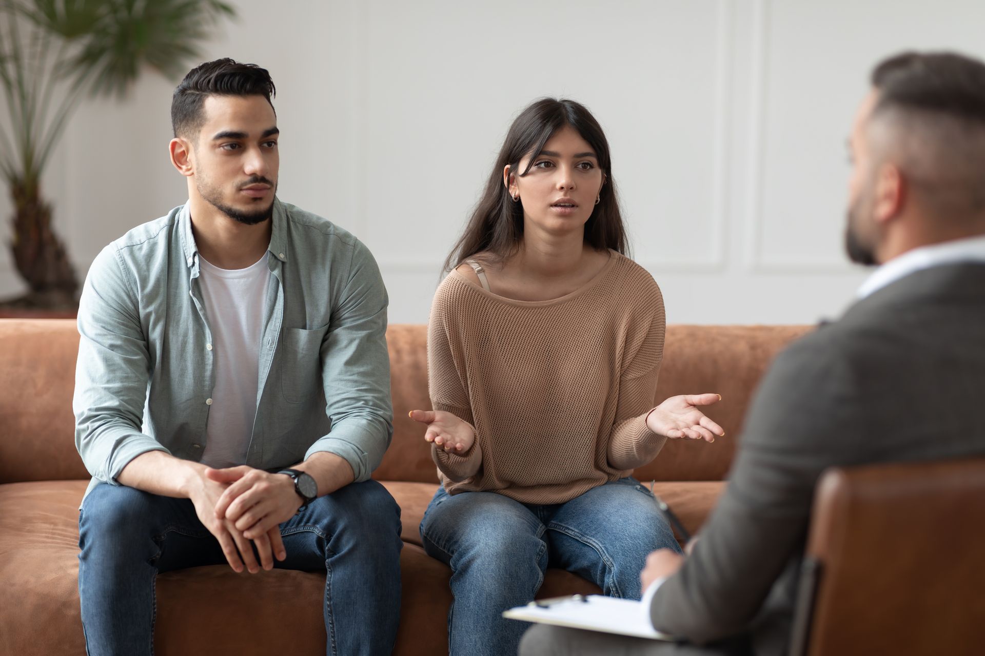 Couple discussing spousal support options with an attorney. Couple discussing spousal support options with an attorney.