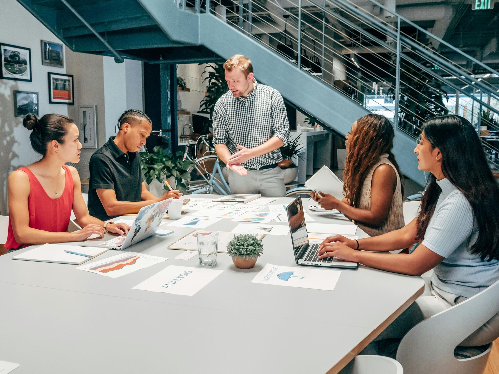 Team discussing Amazon advertising strategy in office meeting