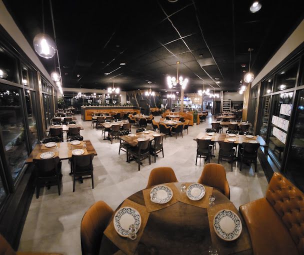A restaurant with a lot of tables and chairs