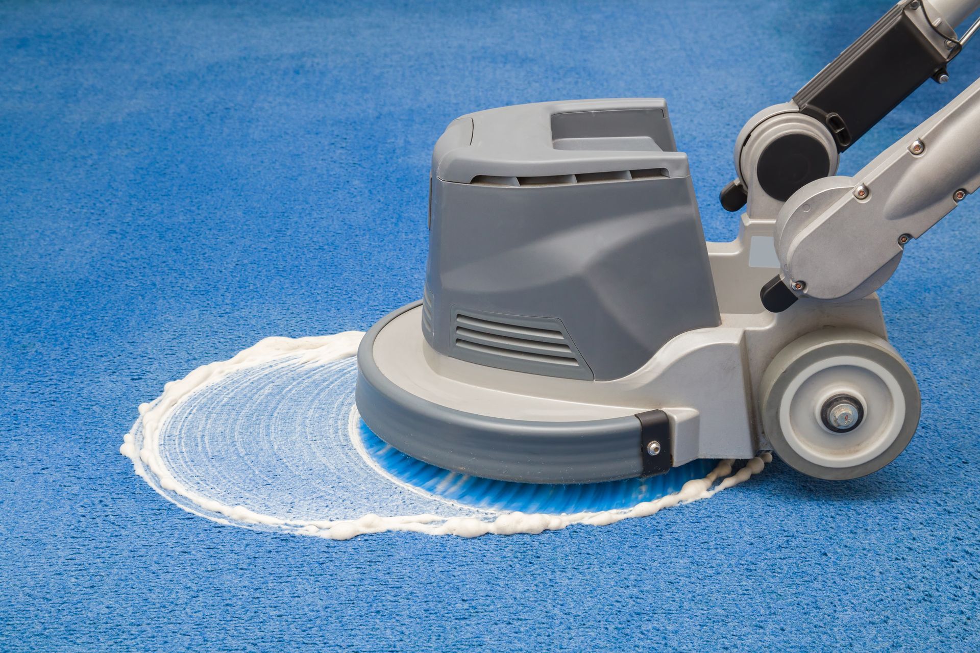 Deep carpet cleaning service in action with a high-powered industrial floor scrubber and foam. Deep carpet cleaning service in action with a high-powered industrial floor scrubber and foam.