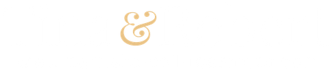 Gold ampersand symbol on a white background