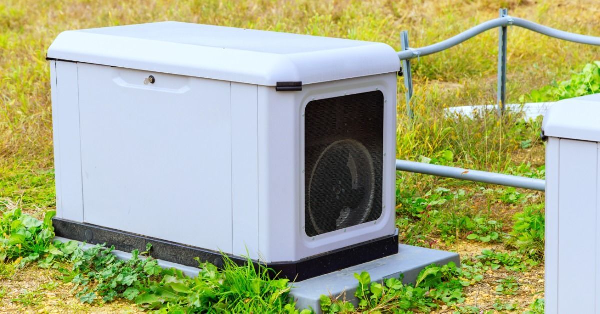 A close-up of a residential standby electrical power generator on a concrete slab.