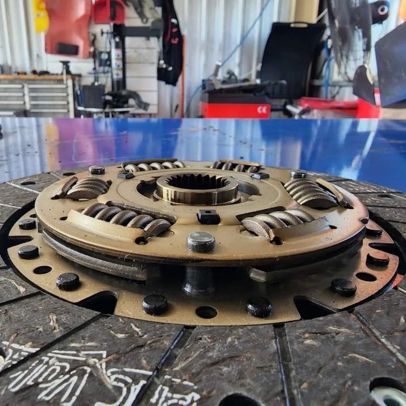 A Close Up Of A Clutch Plate With The Word Wolf On It — M8S Rates Mechanical In Gladstone Central, QLD