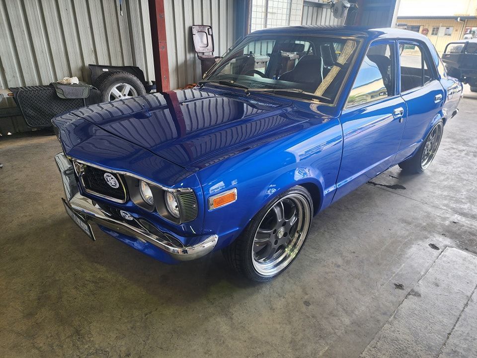 A Blue Car Is Parked In A Garage — M8S Rates Mechanical In Gladstone Central, QLD